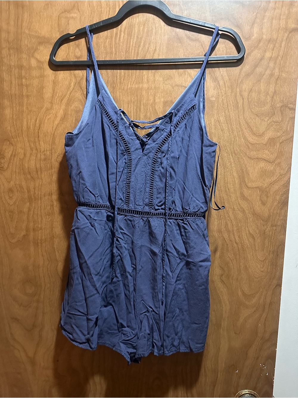 Blue Rain navy sleeveless romper with lace-up V-neck